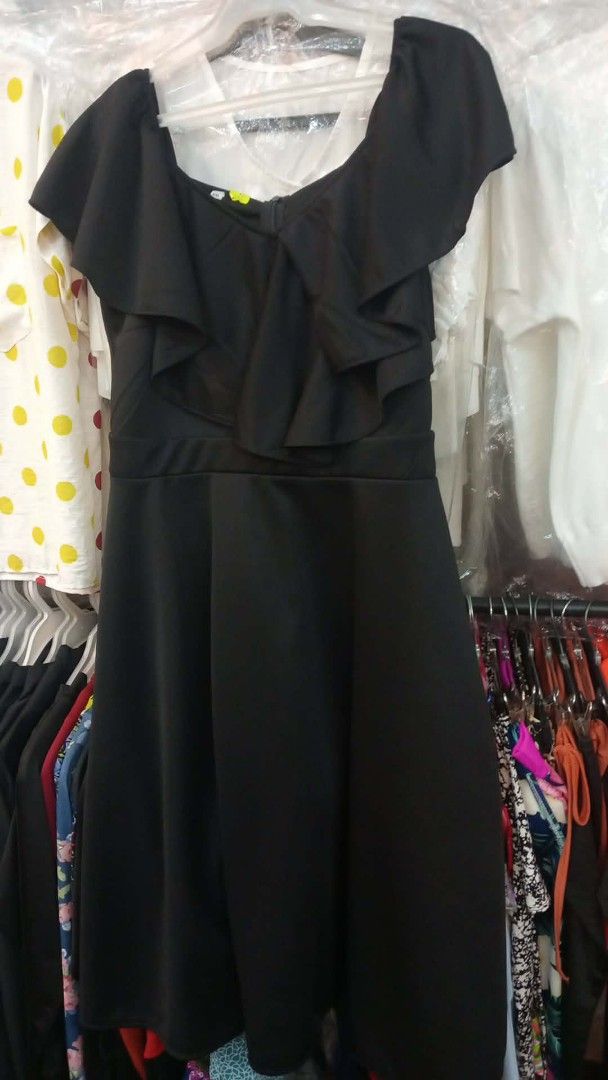 Black Off-Shoulder Ruffle Dress (Category: Dresses) located in Imus. Submitted by melanie.comfortsourc.915 (Listing ID 1462406058, Image 2). Description: - Elegant black dress - Off-shoulder neckline - Ruffled front detail - Flattering A-line skirt - Zipper closure at the back - Ideal for parties and nights out.