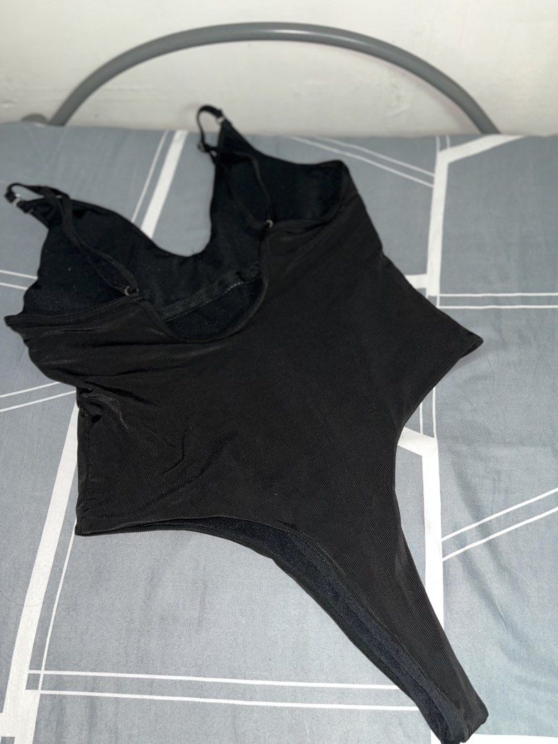 Black Ribbed Thong Bodysuit XL (Category: Bikinis & Swimsuits) located in Manila. Submitted by thelvieee (Listing ID 1462312392, Image 2). Description: - Black ribbed bodysuit - Adjustable straps - Thong bottom - Stretchy material for a comfortable fit - Versatile: perfect for layering or wearing solo - Size: XL.