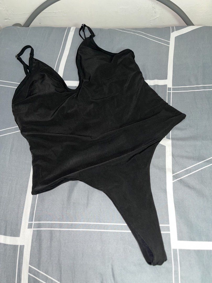 Black Ribbed Thong Bodysuit XL (Category: Bikinis & Swimsuits) located in Manila. Submitted by thelvieee (Listing ID 1462312392, Image 1). Description: - Black ribbed bodysuit - Adjustable straps - Thong bottom - Stretchy material for a comfortable fit - Versatile: perfect for layering or wearing solo - Size: XL.