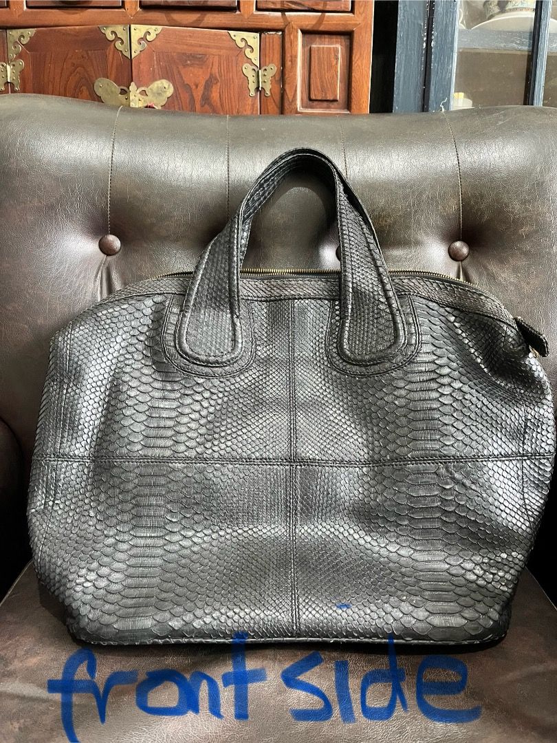 Black Snakeskin Leather Handbag (Category: Purses & Pouches) located in Makati City. Submitted by Ina_Ndang (Listing ID 1462294622, Image 2). Description: - very chic handbag; can be used as laptop or document bag - color is black - genuine snakeskin leather - main bag is zippered; with long strap slot but no strap included - 1 open interior pocket, 1 zippered compartment - navy blue color lining - NO FLAWS but preloved Approximate dimension: 13.