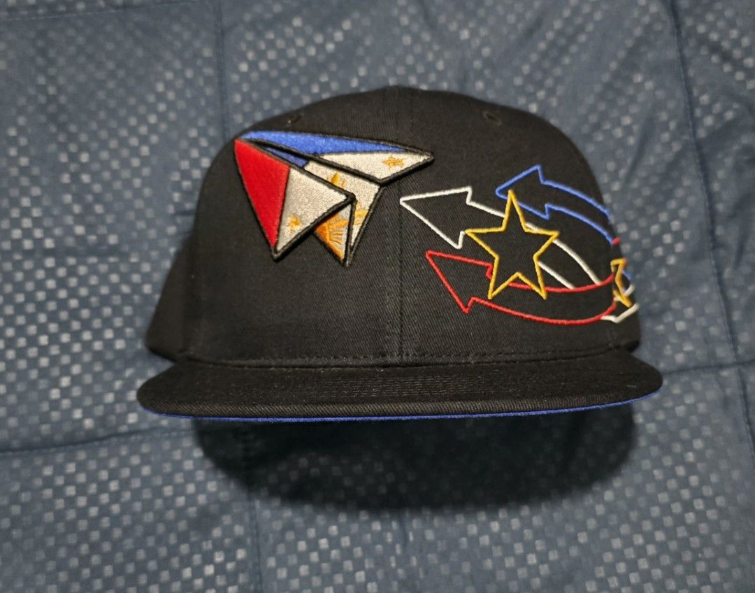 Black Snapback Cap with Philippine Flag Paper Plane Design (Category: Caps & Hats) located in Santa Rosa. Submitted by rowhell09 (Listing ID 1462318589, Image 2). Description: Philppine cap brandnew 1000 MOD. LBC MOP. BDO, GCASH LOC. NUEVA ECIJA - Black snapback cap - Embroidered design on front: Paper plane inspired by Philippine flag - Accents on the side: Stars and lightning bolt - Small skull embroidery on the back - Flat brim with blue under