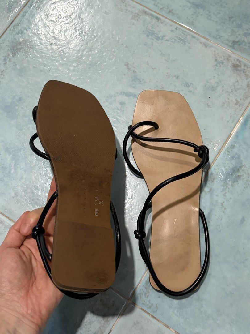 Charles & Keith Black Strappy Flat Sandals (Category: Flats & Sandals) located in Mandaluyong City. Submitted by nv0331 (Listing ID 1462435764, Image 3). Description: - Minimalist black sandals - Thin straps - Square toe design - Secure ankle strap, adjustable - Comfortable flat sole - Versatile for casual or dressed-up outfits.