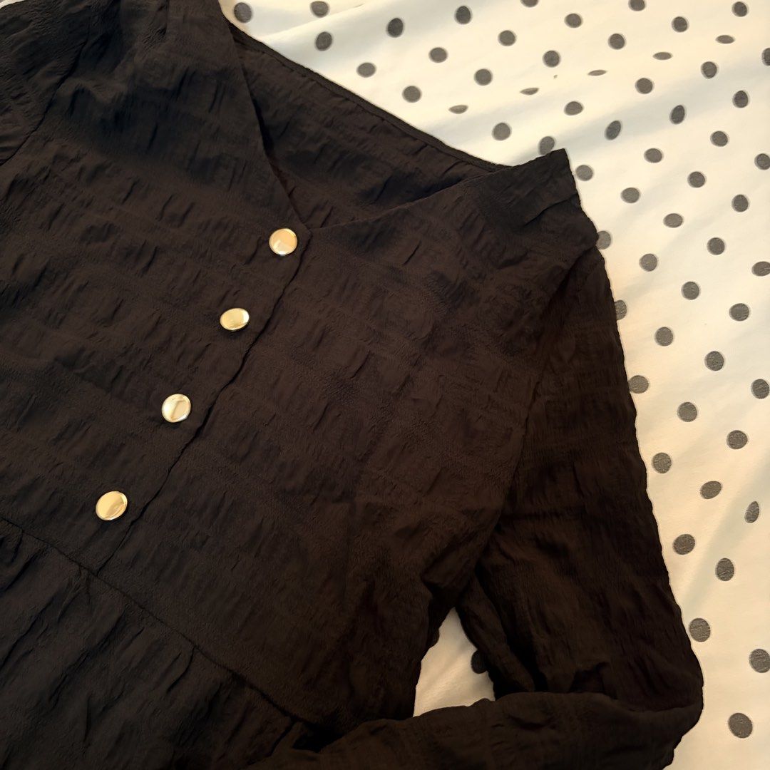 Black Textured Peplum Blouse with Gold Buttons (Category: Blouses) located in Pasay City. Submitted by notellyyyy (Listing ID 1462278698, Image 2). Description: - Black long-sleeved blouse - Textured fabric all over - Flattering peplum hem - Four gold buttons down the front - Collar detail at the neckline - Cuffed sleeves - Perfect for tucking in or wearing out.