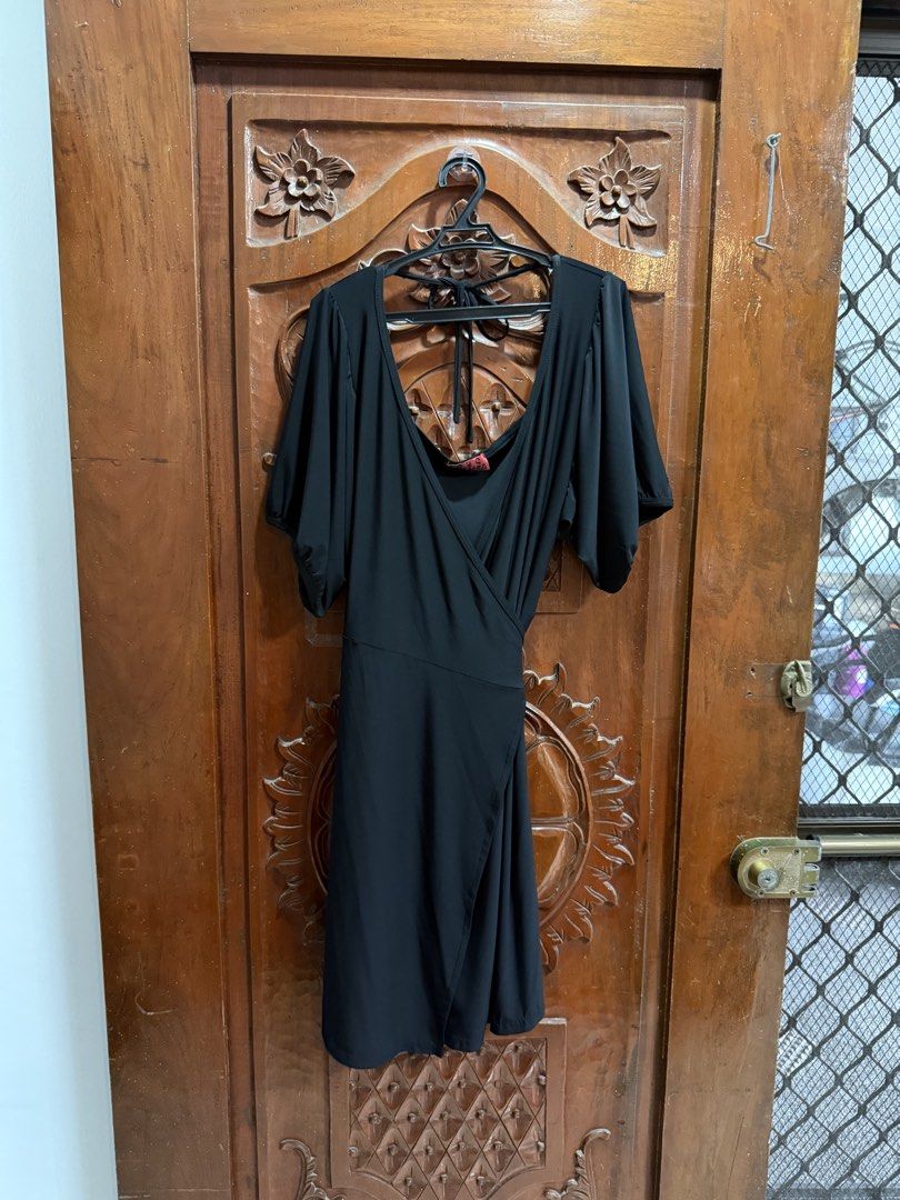 Black Wrap Dress with Flutter Sleeves (Category: Dresses) located in Manila. Submitted by sarj09732 (Listing ID 1462419392, Image 1). Description: - Simple and elegant black wrap dress - Features flattering flutter sleeves for a graceful flow - Adjustable waist tie for a customized, comfortable fit - Highly versatile: perfect for dressing up or down - Suitable for various occasions, from casual outings to more formal events - Looks great worn sol