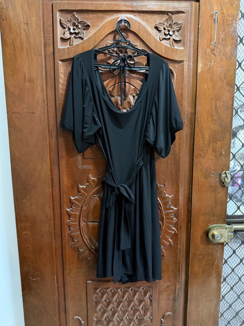 Black Wrap Dress with Flutter Sleeves (Category: Dresses) located in Manila. Submitted by sarj09732 (Listing ID 1462419392, Image 2). Description: - Simple and elegant black wrap dress - Features flattering flutter sleeves for a graceful flow - Adjustable waist tie for a customized, comfortable fit - Highly versatile: perfect for dressing up or down - Suitable for various occasions, from casual outings to more formal events - Looks great worn sol