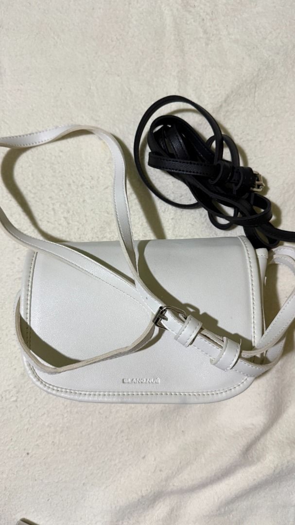 BLANC NUE White Crossbody Bag with Extra Straps (Category: Sling Bags) located in Balanga. Submitted by jayfinds013 (Listing ID 1462325979, Image 2). Description: - White Leather BLANC. NUE. crossbody bag - Includes original dust bag - Comes with a white rope strap and a black leather strap (White rope strap perfect for summer outfit) - Adjustable strap on the bag itself - Small and compact, perfect for essentials - Minimalist design - Delivery s