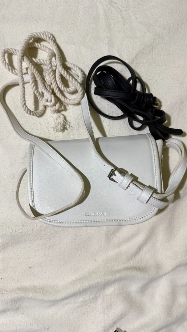 BLANC NUE White Crossbody Bag with Extra Straps (Category: Sling Bags) located in Balanga. Submitted by jayfinds013 (Listing ID 1462325979, Image 1). Description: - White Leather BLANC. NUE. crossbody bag - Includes original dust bag - Comes with a white rope strap and a black leather strap (White rope strap perfect for summer outfit) - Adjustable strap on the bag itself - Small and compact, perfect for essentials - Minimalist design - Delivery s