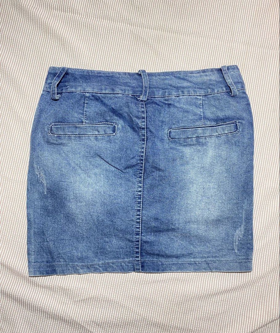 Blue Denim Mini Skirt with Distressed Details (Category: Skirts) located in Paranaque City. Submitted by golden_jinkay (Listing ID 1462421987, Image 2). Description: -Waist:28-30 -Lenght:15 - Cute blue denim mini skirt - Features distressed details on hem and pockets - Waistband size tag: W:28-30 L:15 - Fun and easy to pair with various tops for a casual look.