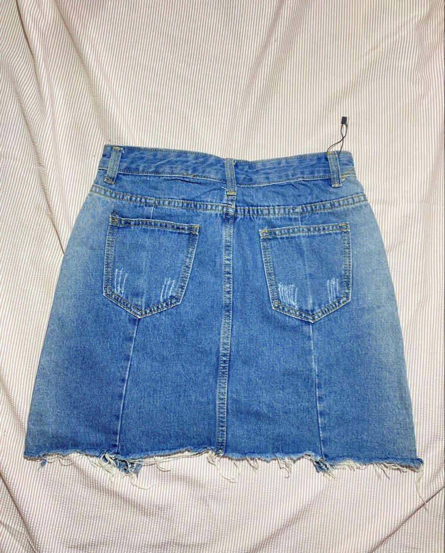 Blue Denim Mini Skirt with Ripped Hem (Category: Skirts) located in Paranaque City. Submitted by golden_jinkay (Listing ID 1462423041, Image 2). Description: -Waist:26 -Lenght:15 - Cute blue denim mini skirt - Frayed hem detail - Distressed rips on front and back - Classic five-pocket styling - Button and zip closure - Easy to style for a casual look with t-shirts or crop tops.