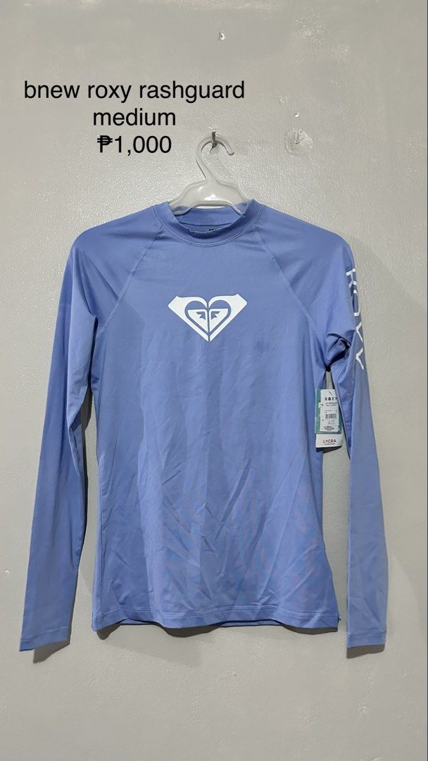 Bnew Roxy Rashguard Medium (Category: Rash guard) located in Manila. Submitted by vhhhhhhh (Listing ID 1462407747, Image 1). Description: - Roxy Rashguard - Color: Light Blue - Size: Medium - Material: Lycra - Features: Iconic Roxy logo on front and sleeve - Ideal for: Swimming, sun protection - Price: P1,000.