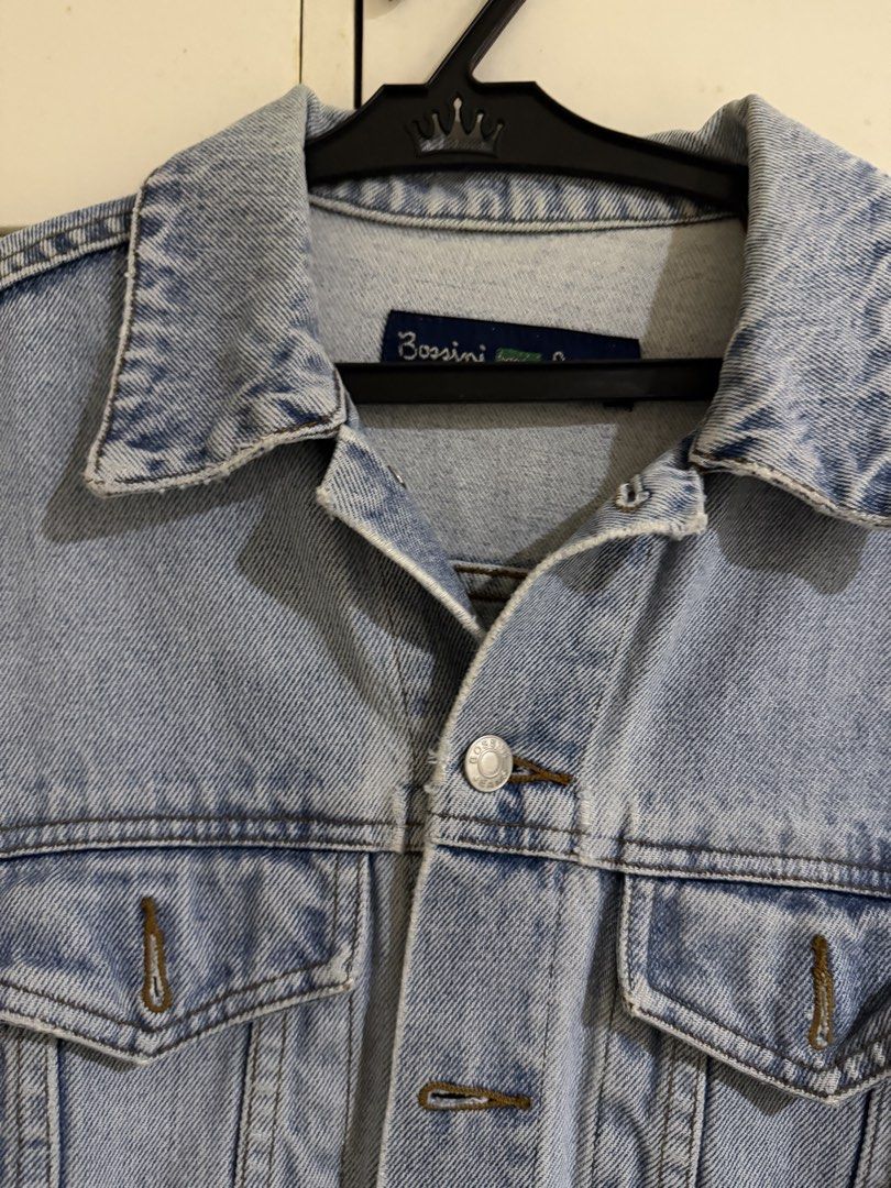Bossini Light Wash Denim Jacket (Category: Coats, Jackets and Outerwear) located in Antipolo. Submitted by elmclothing (Listing ID 1462397934, Image 2). Description: - Classic light wash denim jacket by Bossini - Button-up front closure - Two chest pockets - Standard collar and button cuffs - Essential wardrobe staple, easy to style.