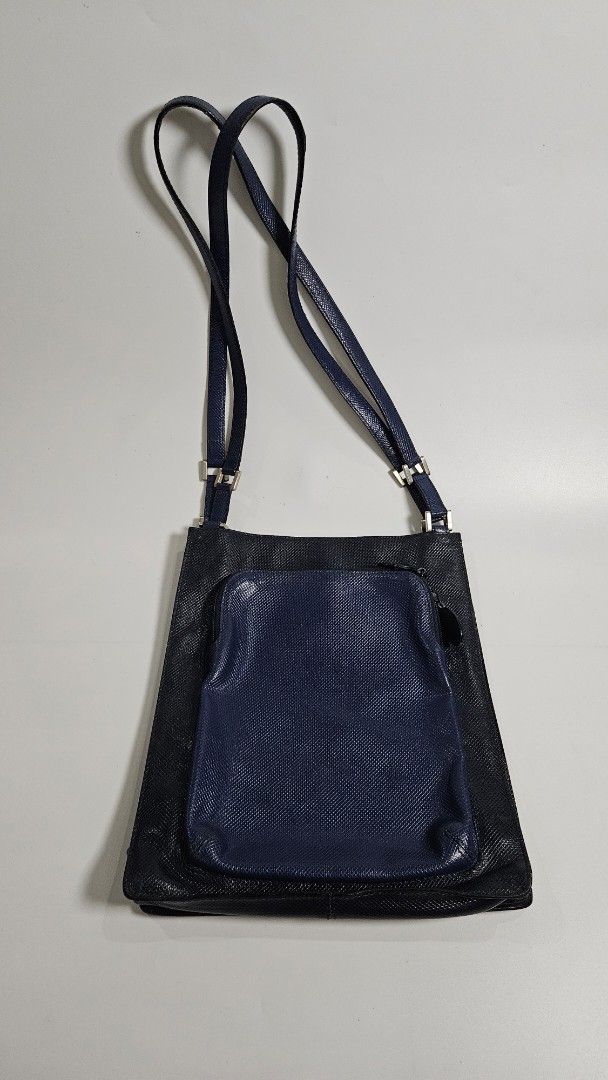 Bottega veneta two tone shoulder Bag (Category: Cross-body Bags) located in Alfonso. Submitted by jbcamet (Listing ID 1462387469, Image 1). Description: - authentic & guranteed - Textured main body for a sophisticated look - Convenient front pouch for quick access - Adjustable strap with sleek silver hardware - Secure zipper closure for the main compartment - Interior lining with a subtle, attractive pattern - Ideal for everyday use and errands.