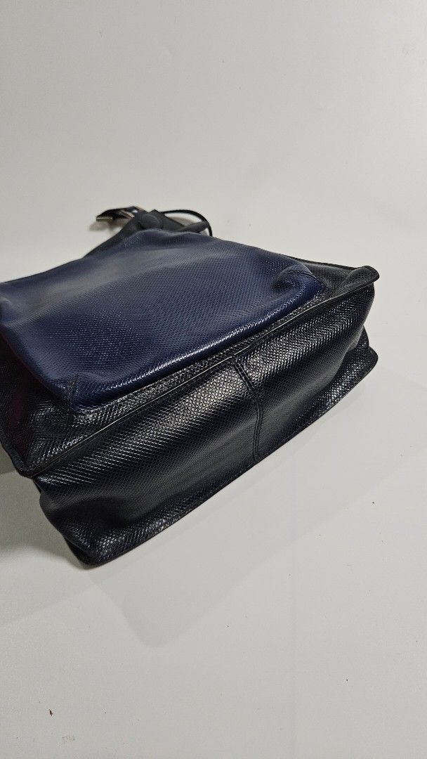 Bottega veneta two tone shoulder Bag (Category: Cross-body Bags) located in Alfonso. Submitted by jbcamet (Listing ID 1462387469, Image 2). Description: - authentic & guranteed - Textured main body for a sophisticated look - Convenient front pouch for quick access - Adjustable strap with sleek silver hardware - Secure zipper closure for the main compartment - Interior lining with a subtle, attractive pattern - Ideal for everyday use and errands.