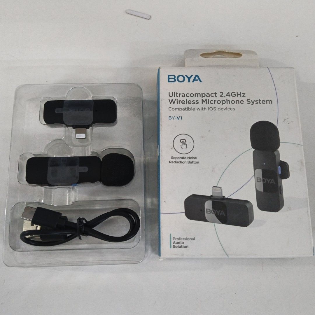 BOYA BY-V1 Ultracompact 2.4GHz Wireless Microphone System for iOS (Category: Microphones) located in Caloocan City. Submitted by coolgem_3f10a0 (Listing ID 1462401421, Image 1). Description: - BOYA BY-V1 Wireless Microphone System - Ultracompact design for portability - Reliable 2.4GHz wireless transmission - Specifically compatible with iOS devices - Complete set: includes transmitter, receiver, and charging cable - Dedicated noise reduction but