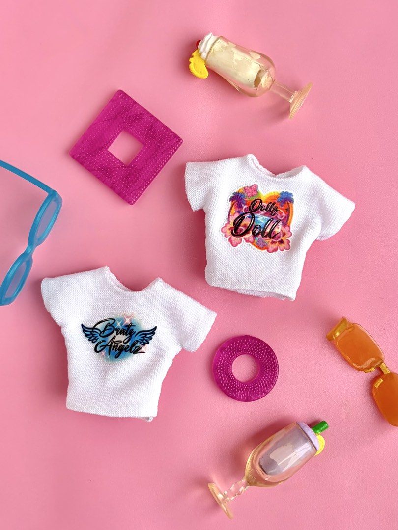 Bratinellaz Airbrush Tees (Category: Shirts) located in Quezon City. Submitted by bratinellaz (Listing ID 1462350318, Image 2). Description: 👄NEW COLLECTION👄 Bratinellaz Airbrush Tees (2 designs) 💅🏽 Php 150 each 💅🏽 Shirt only (Doll, other clothes and accessories not included) 💅🏽 This is handmade so expect some imperfections 💅🏽 Do not wash, glue dissolves in water 💅🏽 GCASH/BDO 💅🏽 JNT/Lalamove .