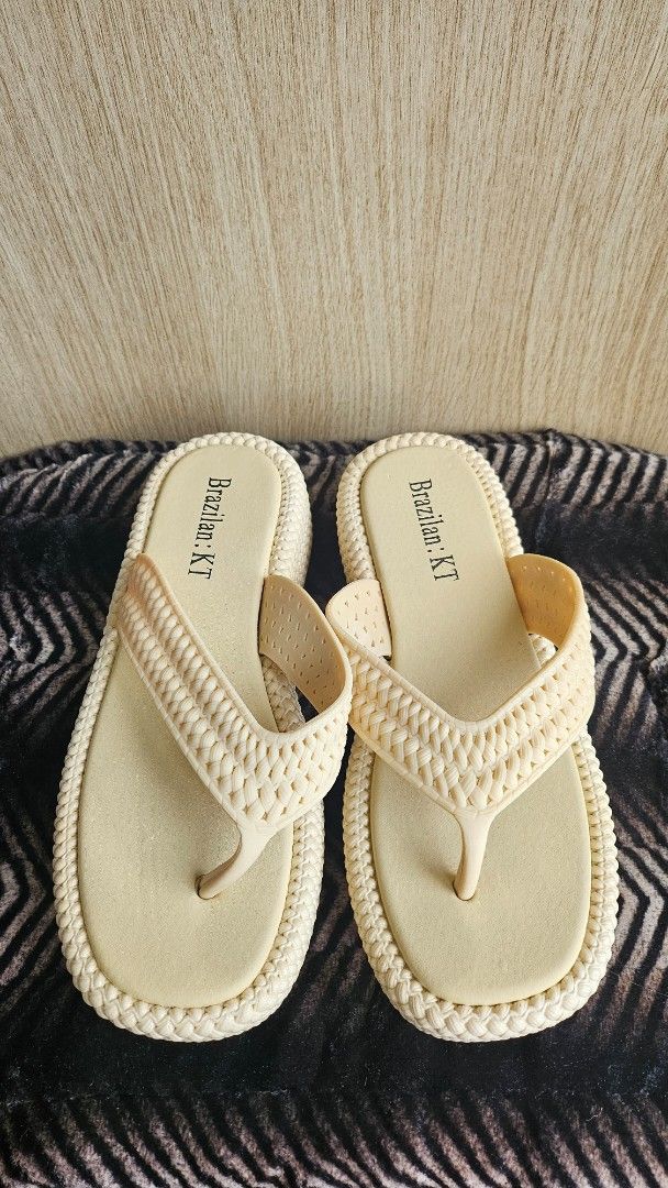 Brazilian KT Beige Flip-Flops (Category: Slippers and slides) located in Makati City. Submitted by shannebun (Listing ID 1462264986, Image 2). Description: Comfy beige KT flip-flops with woven straps. Perfect for beach or casual wear. Easy slip-on style..