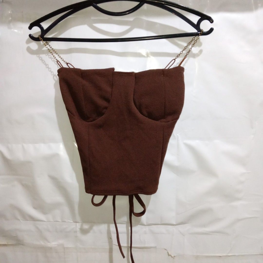 Brown Corset Top with Chain Detail (Category: Others Tops) located in Manila. Submitted by cian.collectives (Listing ID 1462380385, Image 1). Description: ✨ Title: Brown Corset Top with Chain Detail Description: Great and thick fabric, fit to XS-S, with padding and can make ribbon in the back. Comfy to wear. Price: 80.00 Flaws: none Payment Methods: Gcash, Maya (Payment First - No COD) 📍 Note: PLEASE MANAGE YOUR EXPECTATIONS, PRELOVED ITEMS, NO 