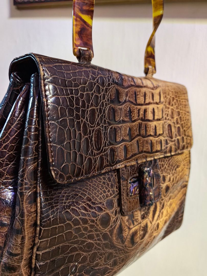 Brown Crocodile Handbag with Tortoiseshell Handle (Category: Luxury Bags & Wallets) located in Tarlac. Submitted by jeremiah.curator.2026 (Listing ID 1462432517, Image 2). Description: - Soft Crocodile Leather Skin - Unique tortoiseshell-style handle - With stylish clasp closure - Interior zippered compartment - Vintage feel, perfect for making a statement.