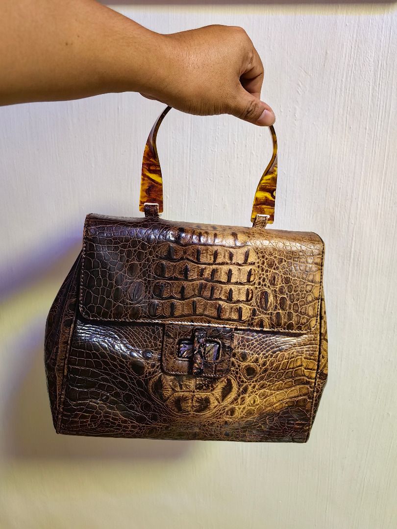 Brown Crocodile Handbag with Tortoiseshell Handle (Category: Luxury Bags & Wallets) located in Tarlac. Submitted by jeremiah.curator.2026 (Listing ID 1462432517, Image 1). Description: - Soft Crocodile Leather Skin - Unique tortoiseshell-style handle - With stylish clasp closure - Interior zippered compartment - Vintage feel, perfect for making a statement.
