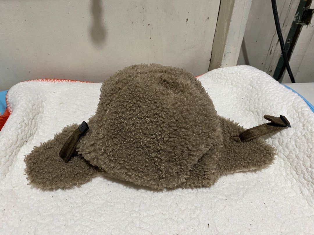 Brown Fuzzy Trapper Hat with Ear Flaps (Category: Caps & Hats) located in Manila. Submitted by resi.diaz (Listing ID 1462345067, Image 3). Description: - Super warm and fuzzy trapper hat - Classic brown color with stylish white trim - Ear flaps can be tied up for versatility - Ideal for keeping warm in cold weather - One size fits most - Soft material for ultimate comfort, inside and out.