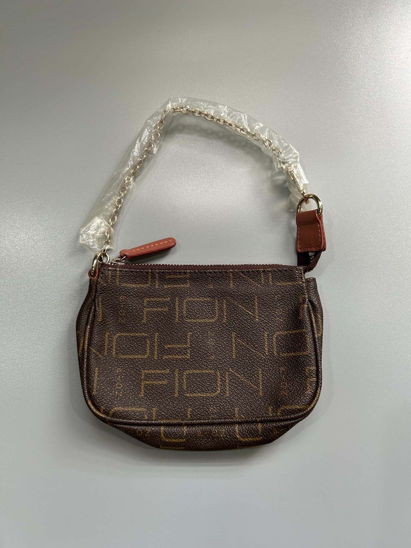Brown Monogram Butterfly Shoulder Bag (Category: Luxury Bags & Wallets) located in Manila. Submitted by heycessygirl (Listing ID 1462394156, Image 2). Description: - Cute brown shoulder bag - Monogram pattern - Pink butterfly applique on front - Gold chain strap (plastic wrap still on) - Small and compact, ideal for essentials - Zipper closure.