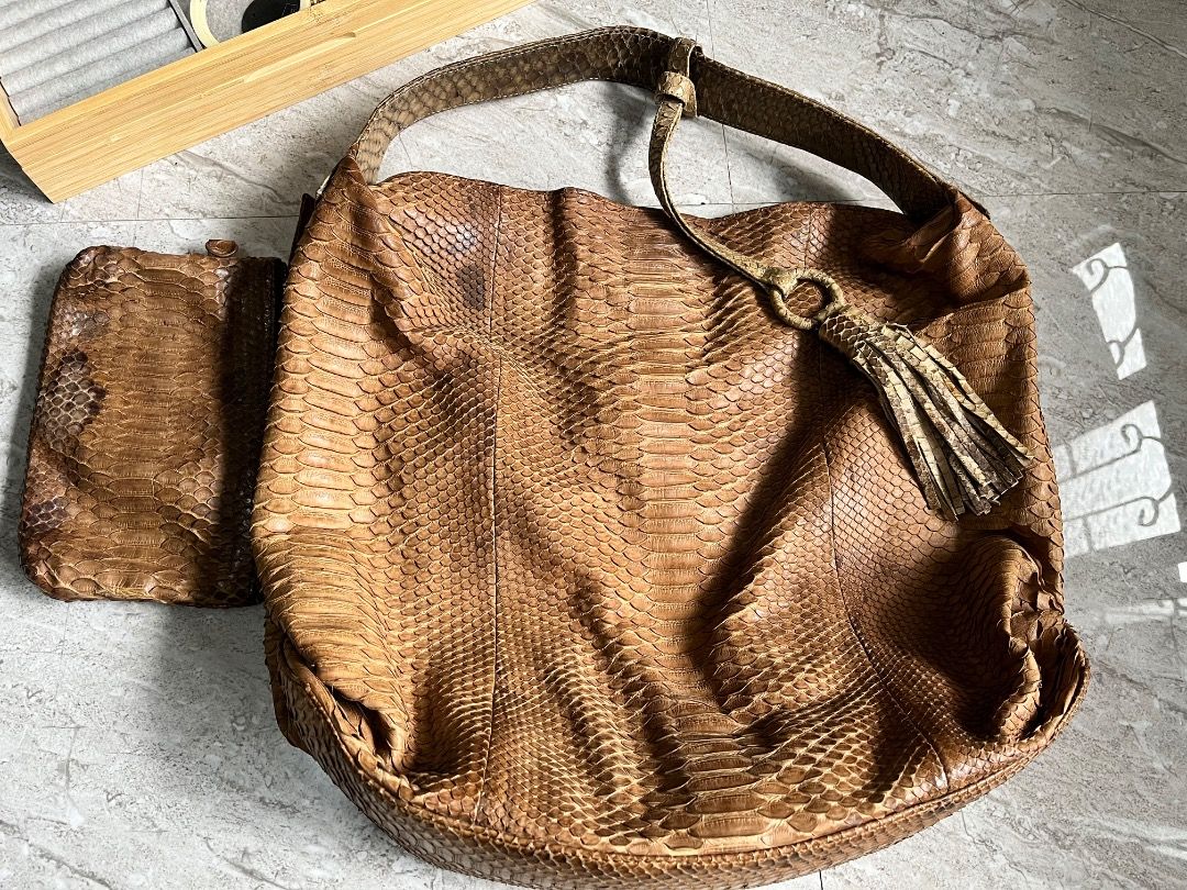 Brown Python Snakeskin Shoulder Bag with Tassel (Category: Shoulder Bags) located in Makati City. Submitted by Ina_Ndang (Listing ID 1462289943, Image 2). Description: - hobo style bag; can fit laptop and other essentials - genuine snakeskin leather - tan brown/mocha color - with interior pockets and removable pochette/small wallet - magnetic button closure - one of my faves among my exotic bag collections FLAWS: - dark stain on exterior, already