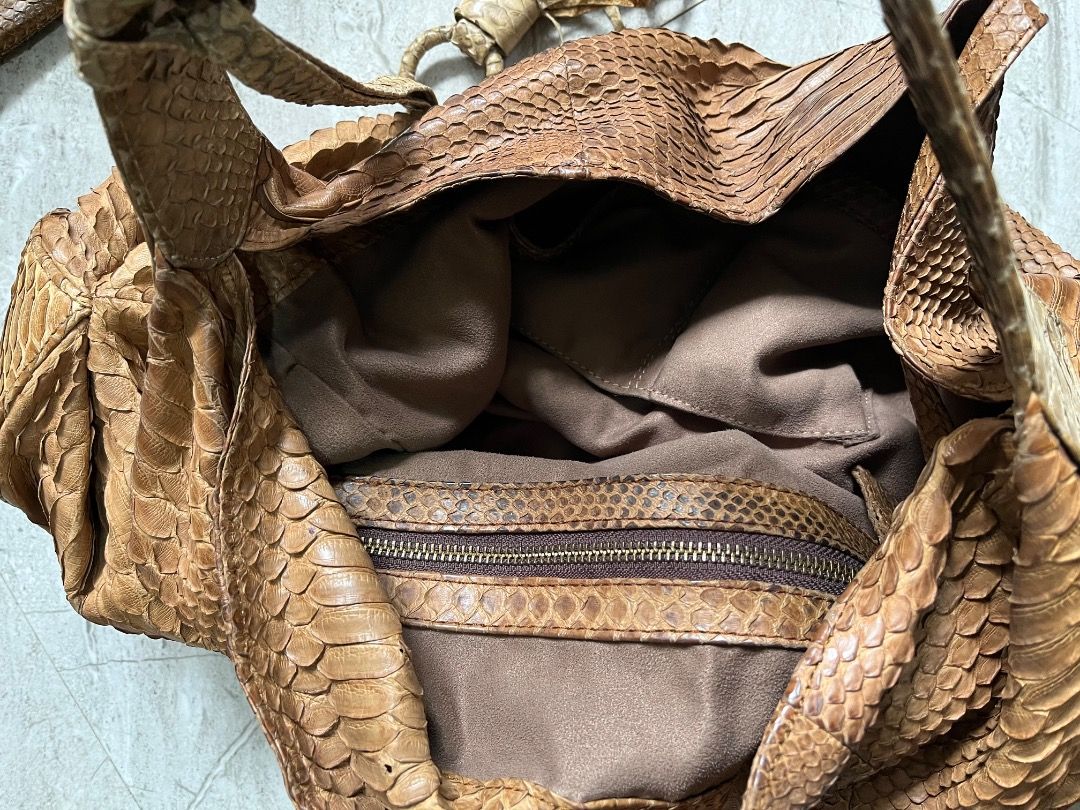 Brown Python Snakeskin Shoulder Bag with Tassel (Category: Shoulder Bags) located in Makati City. Submitted by Ina_Ndang (Listing ID 1462289943, Image 3). Description: - hobo style bag; can fit laptop and other essentials - genuine snakeskin leather - tan brown/mocha color - with interior pockets and removable pochette/small wallet - magnetic button closure - one of my faves among my exotic bag collections FLAWS: - dark stain on exterior, already