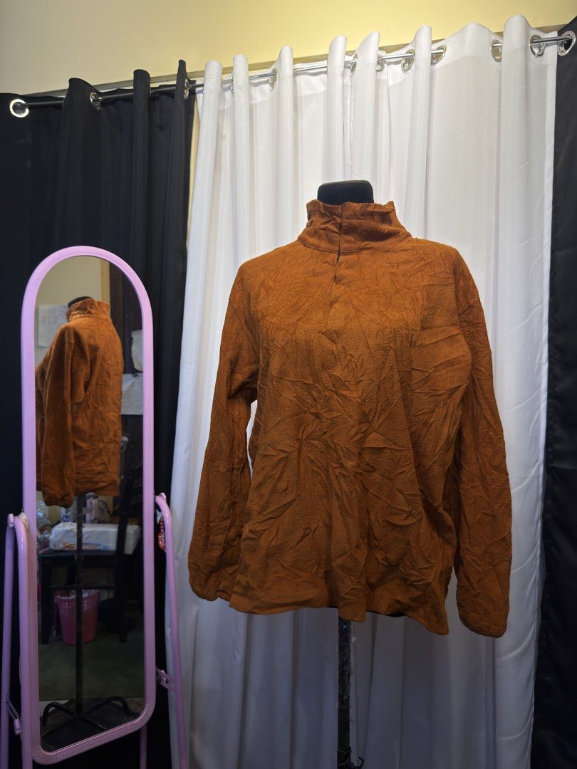 Brown Textured Turtleneck Long Sleeve Top (Category: Longsleeves) located in Pulilan. Submitted by _sevegn (Listing ID 1462306382, Image 1). Description: - Brown long sleeve top - Textured, crinkled fabric - Mock neck with back button closure - Versatile for layering or wearing alone - Comfortable and stylish design.