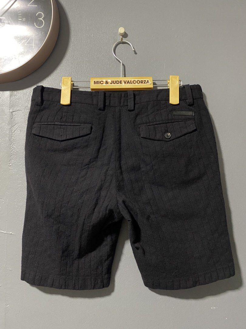 Burberry Black Pinstripe Tailored Shorts (Category: Shorts) located in Tanay. Submitted by judevalcorza (Listing ID 1462408488, Image 2). Description: - Black tailored shorts with subtle pinstripe texture. - Burberry Short size 32 length 17 - Secure button and zip front closure. - Two functional back pockets with button details. - Inner lining features the classic Burberry check pattern. - Ideal for achieving a stylish smart casual look. - excell