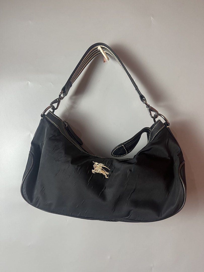 Burberry blue label shoulder bag (Category: Shoulder Bags) located in Quezon City. Submitted by theideal (Listing ID 1462288454, Image 1). Description: Read first before buy Legit/Authentic Burberry blue label shoulder bag Still in good and presentable condition No major flaws Minor sign of use only See picture details posted.