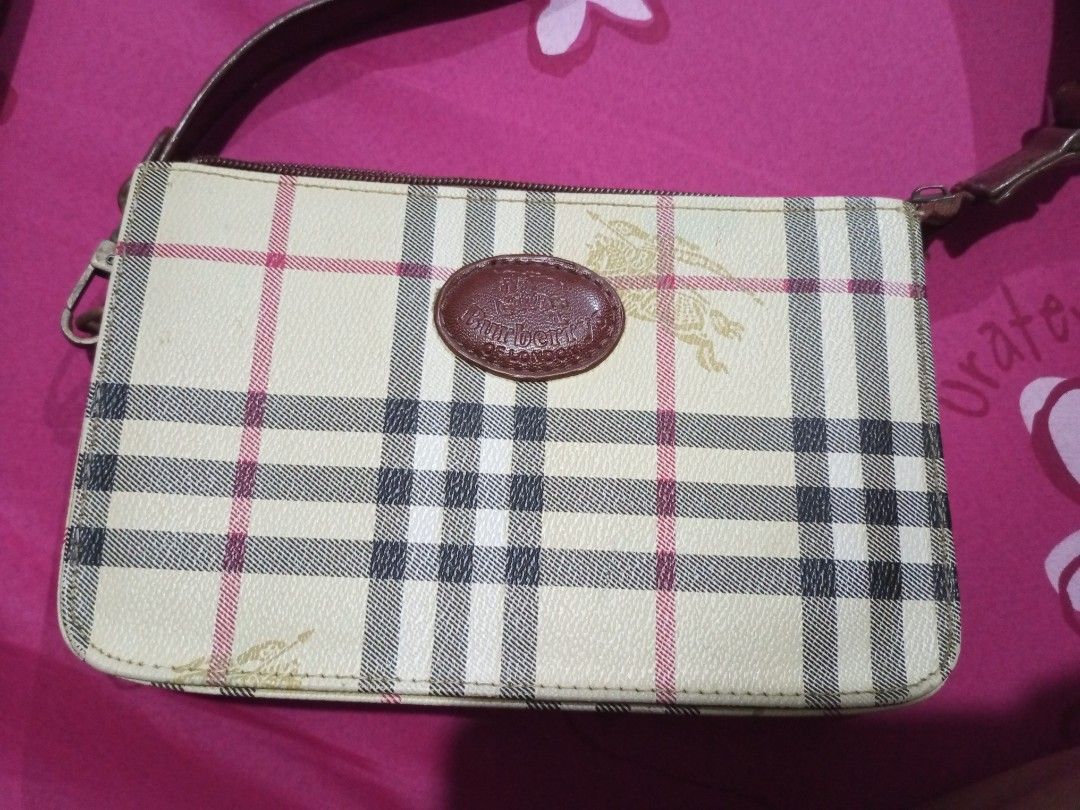 Burberry Nova Check Shoulder Bag (Category: Luxury Bags & Wallets) located in Manila. Submitted by _thrifters (Listing ID 1462398647, Image 1). Description: - Classic Burberry shoulder bag - Iconic Nova Check pattern - Leather trim and strap - Secure zipper closure - Small oval logo detail on the front - Ideal for everyday use - Note: Shows some signs of wear on the strap and edges.