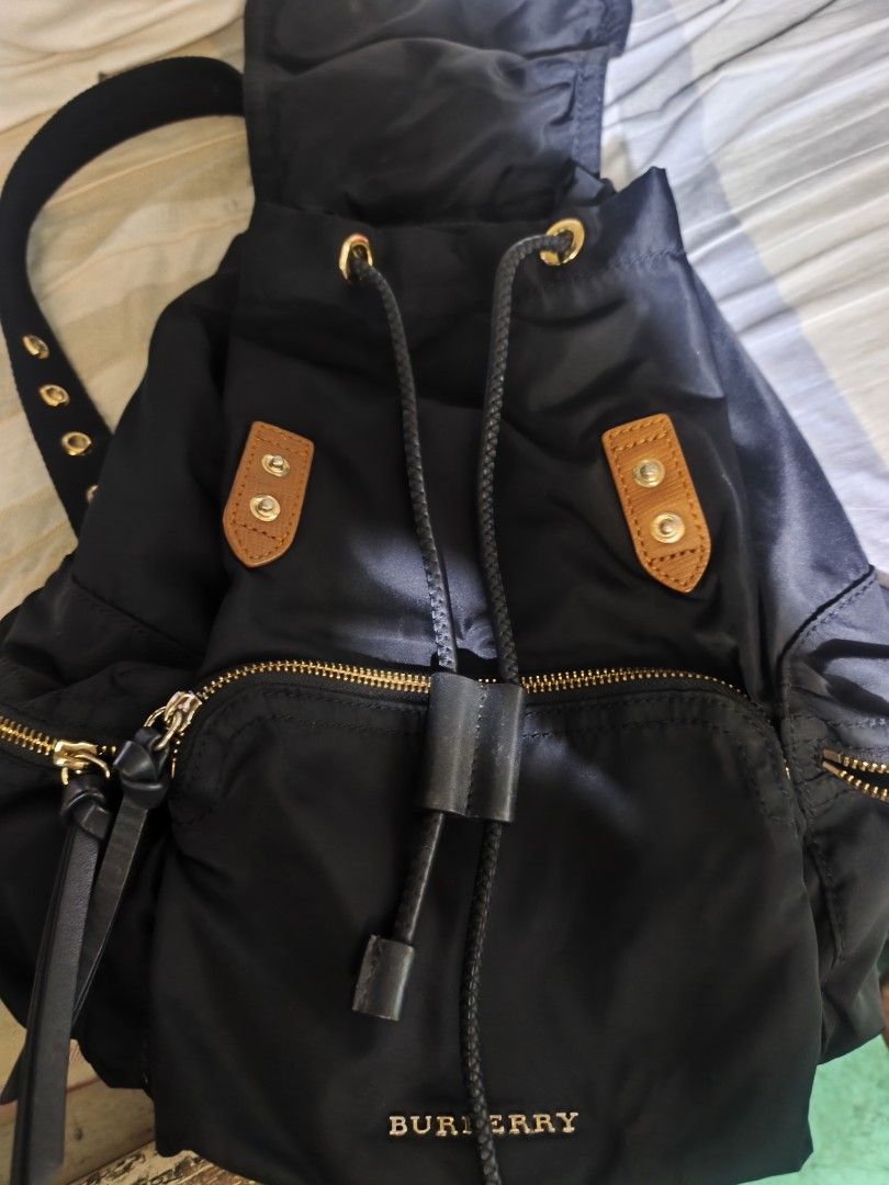 BURBERRY Nylon Leather Backpack Rucksack Gold Chain (Category: Luxury Bags & Wallets) located in Manila. Submitted by rms.thrift (Listing ID 1462439786, Image 2). Description: aunthetic like new no issue.