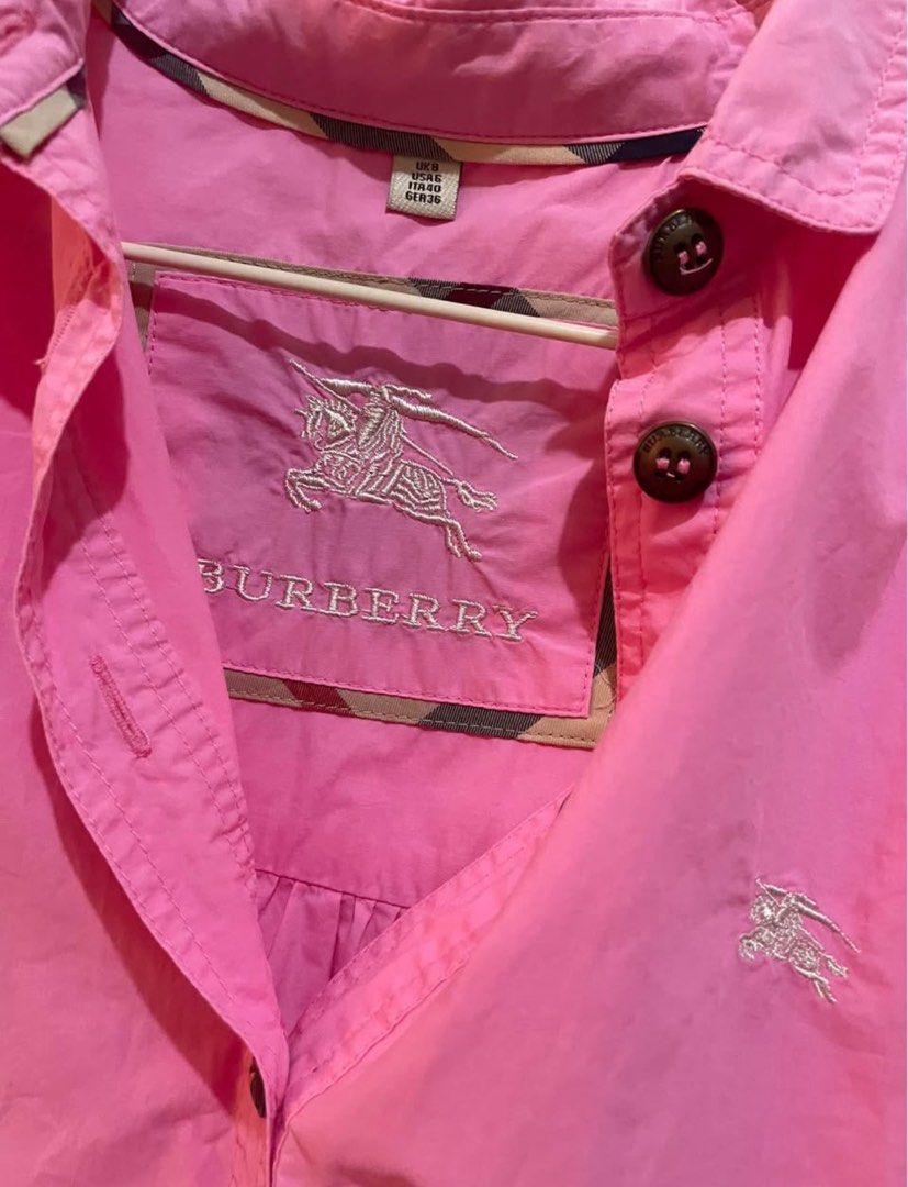 Burberry Pink Tunic Shirt (Category: Shirts) located in Manila. Submitted by satria_fatima (Listing ID 1462405326, Image 2). Description: - Cute pink Burberry tunic shirt - Features iconic Burberry check lining inside the collar - Button-up front with a collar - Three-quarter sleeves - Convenient side pockets - Ideal for casual everyday wear.