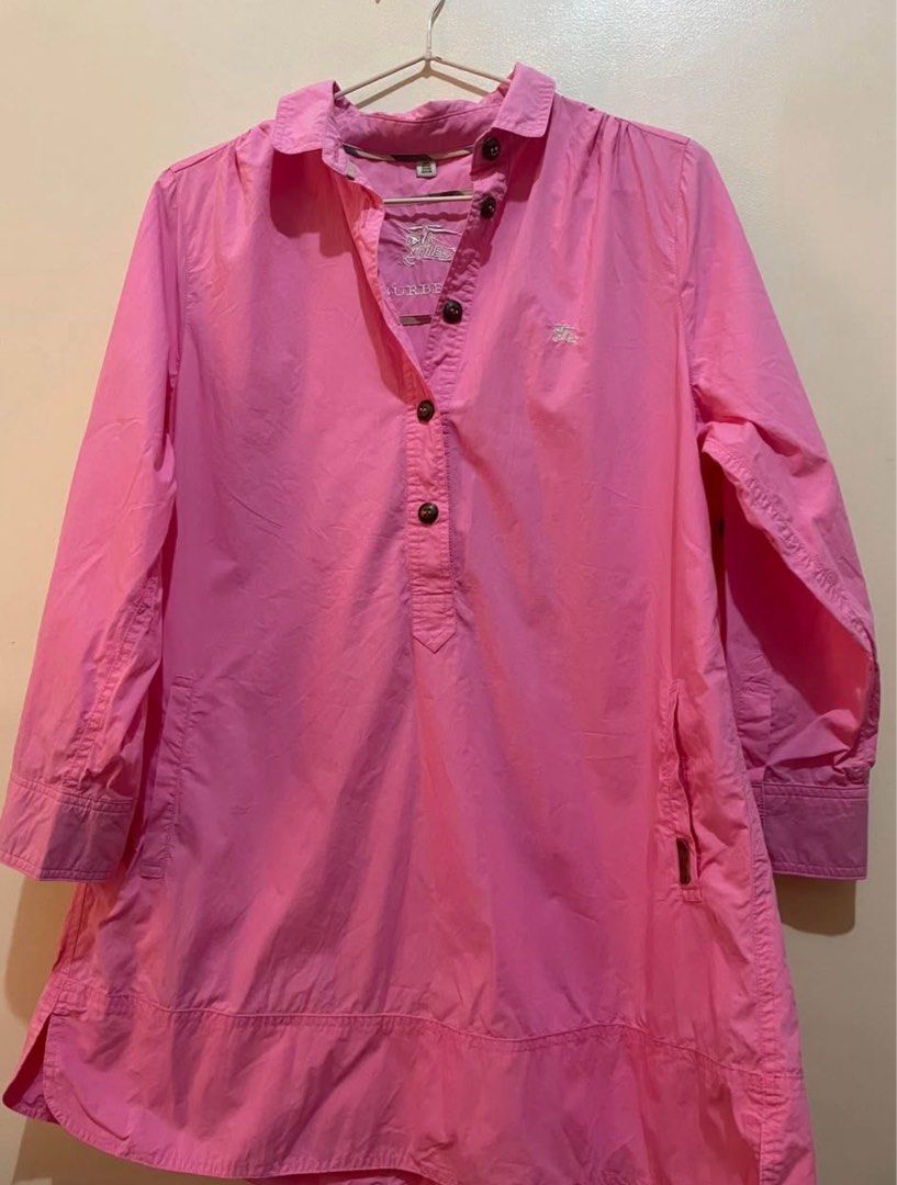 Burberry Pink Tunic Shirt (Category: Shirts) located in Manila. Submitted by satria_fatima (Listing ID 1462405326, Image 1). Description: - Cute pink Burberry tunic shirt - Features iconic Burberry check lining inside the collar - Button-up front with a collar - Three-quarter sleeves - Convenient side pockets - Ideal for casual everyday wear.