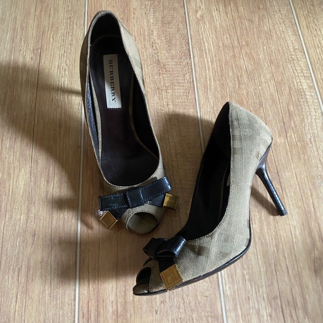 Burberry Plaid Peep-Toe Bow Heels (Category: Heels) located in Bacacay. Submitted by curatedsbyjj (Listing ID 1462303560, Image 3). Description: 100% Authentic. Kindly see photos for the condition. Size 36C on Label, Insole is 25 CM. Heel height is 3.5 inches. No inclusions. Please refer to the 2nd photo for the actual color. > Notes & Reminders: Please manage expectations, as this is a pre-loved item and may have minor flaws that were not notice