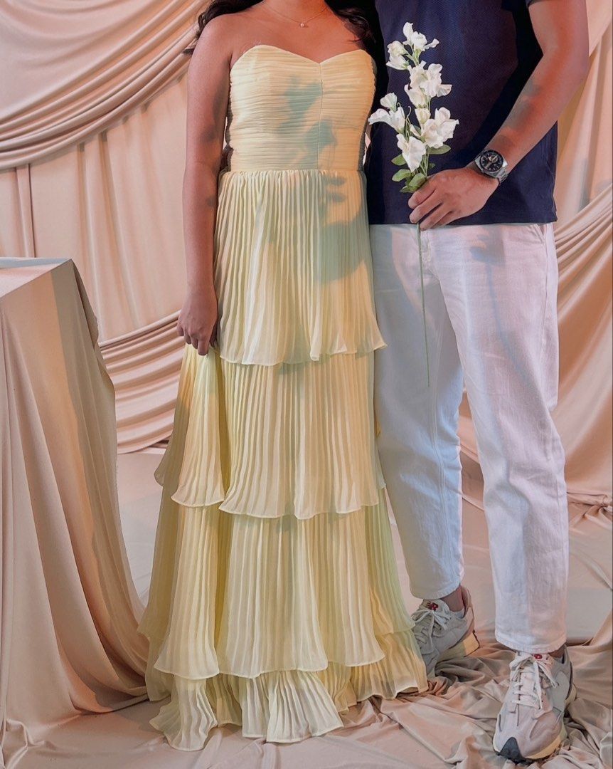 Butter yellow dress (rent) (Category: Evening dresses & gowns) located in Quezon City. Submitted by usercdam (Listing ID 1462274445, Image 2). Description: Rent - ₱1000 (3days) Buy - ₱2500 (nego) Purchased it for ₱3900 Used it for a shoot Fits S-XS or US 2-4 Laced corset-style tie-back with supportive back panel Lightly padded for enhanced shape and comfort Includes invisible straps — can be hidden or removed based on preference Bust 83-84cm Wais