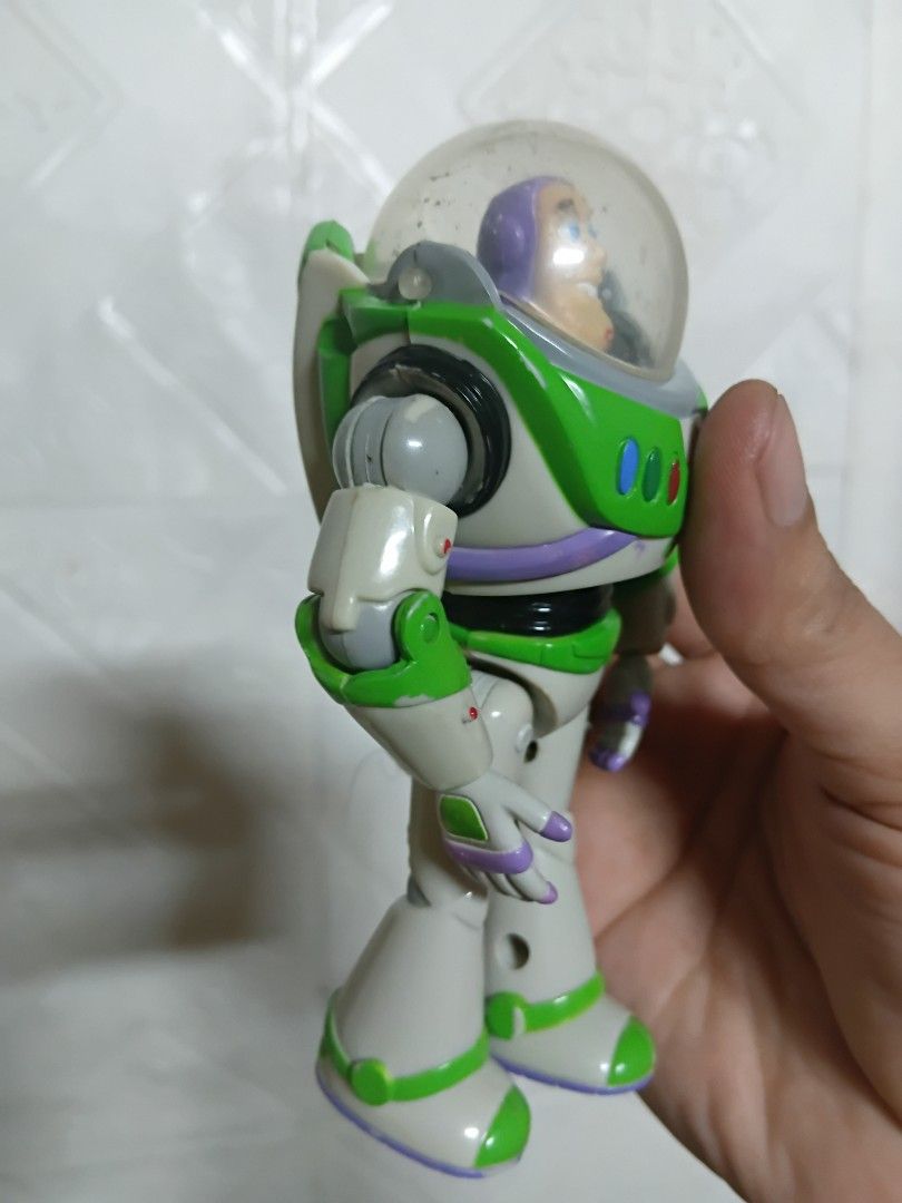 Buzz Light Year (Category: Action & Battle Toys) located in Quezon City. Submitted by coffeeyuki56158 (Listing ID 1462403517, Image 3). Description: authentic thinkway brand toys disney pixar buzz lightyear from the movie toy story may mga scratches nadin po especially sa part ng dome or windshield protector nya , expect sa mga secondhand and considered vintage nadin po ito , also some fades nadin sa mga ibang details , hindi po na oopen yung dom