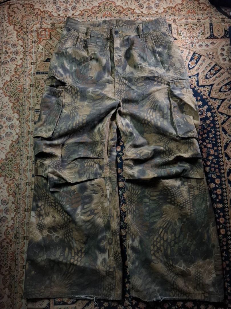 Camouflage Cargo Pants with Multiple Pockets (Category: Jeans) located in Cagayan de Oro. Submitted by prudentials.ph (Listing ID 1462265596, Image 2). Description: CAMOUFLAGE BAGGY CARHO JEANS Size: 34 lenght: 43 thigh: 14 leg opening: 12 (M) mine 500+SF model's height: 5'7 model's size: 30 DM @prudentials.ph on Instagram for more inquiries!.