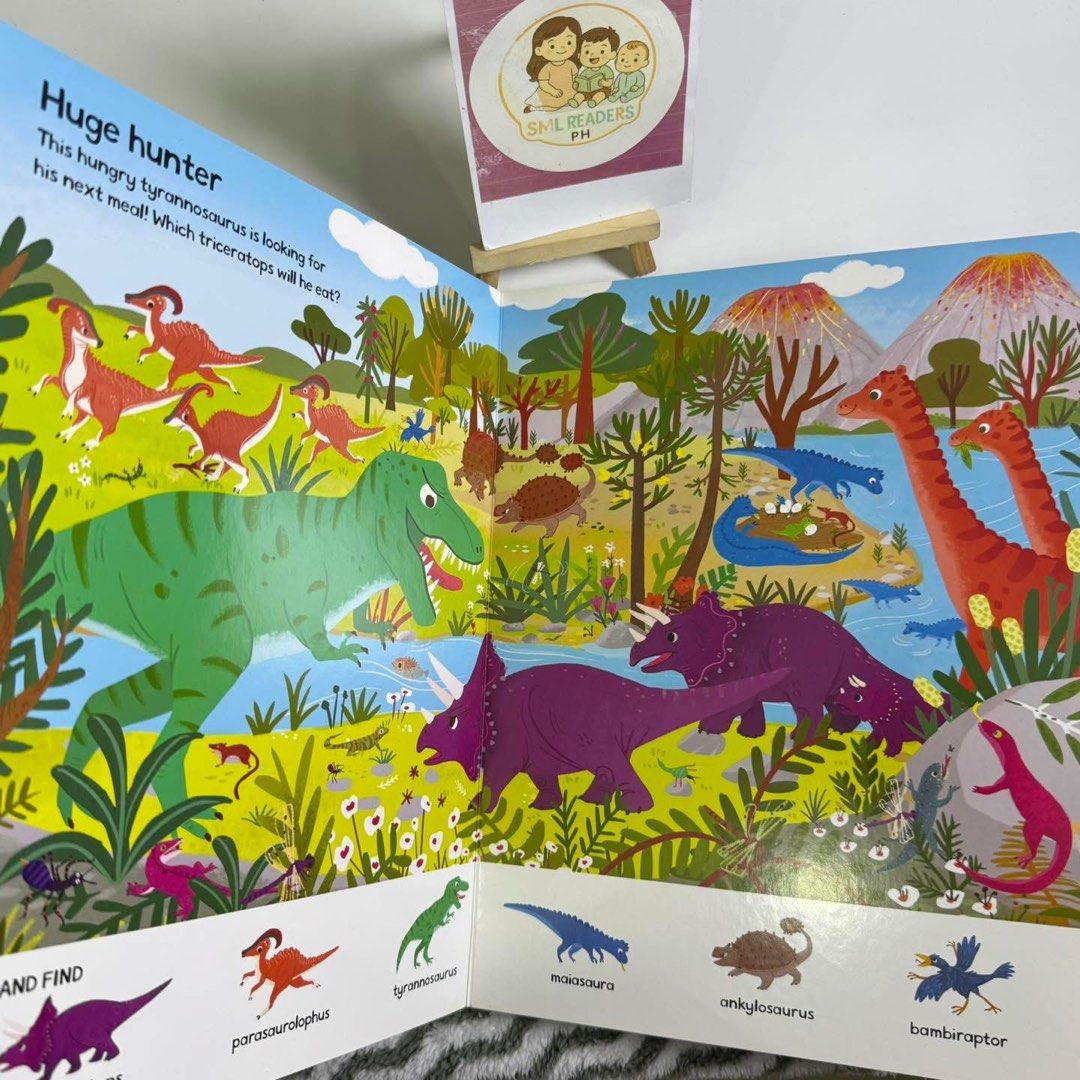 Campbell Dinosaur Lands (Category: Children's Books) located in Taguig. Submitted by smlreadersph (Listing ID 1462362096, Image 3). Description: 💗 𝐃𝐢𝐧𝐨𝐬𝐚𝐮𝐫 𝐋𝐚𝐧𝐝𝐬 🦖🌋 Large Search & Find Board Book • Campbell 📖 Condition: Preloved with shelf wear at the lower spine. Pages are still nice and ready for fun search-and-find adventures. ✨ 👧👦 Age Recommended: 3–6 years 📘 About the Book: Explore exciting dinosaur lands and put little e