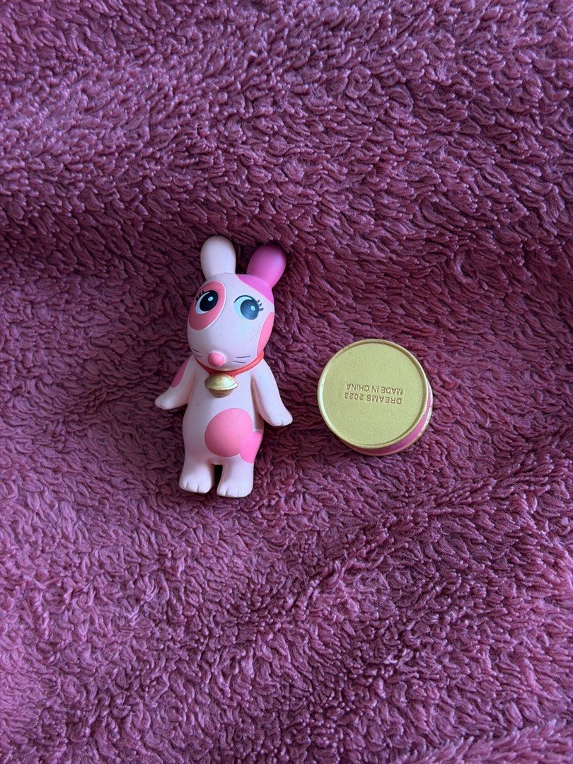 Cat Life Robby (Category: Designer & Blind Box Toys) located in Manila. Submitted by honiieee (Listing ID 1462279989, Image 1). Description: - Cute pink bunny figurine - Features a little bell around its neck - Adorned with small wings on its back - Comes with a small gold tin - Made in China - Ideal for collectors or as a small gift.
