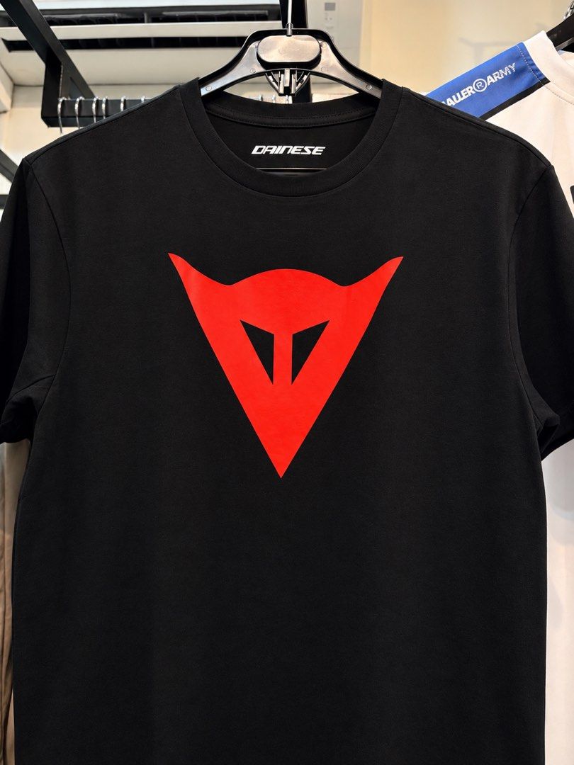 CB DAINESE TSHIRT (Category: Tshirts & Polo Shirts ) located in Manila. Submitted by beacerbito (Listing ID 1462344410, Image 2). Description: - Classic black t-shirt from Dainese - Features iconic red Dainese logo on the front - Simple crew neck and short sleeves - Made from good quality cotton - Versatile for casual wear or layering - Easy to style with jeans.