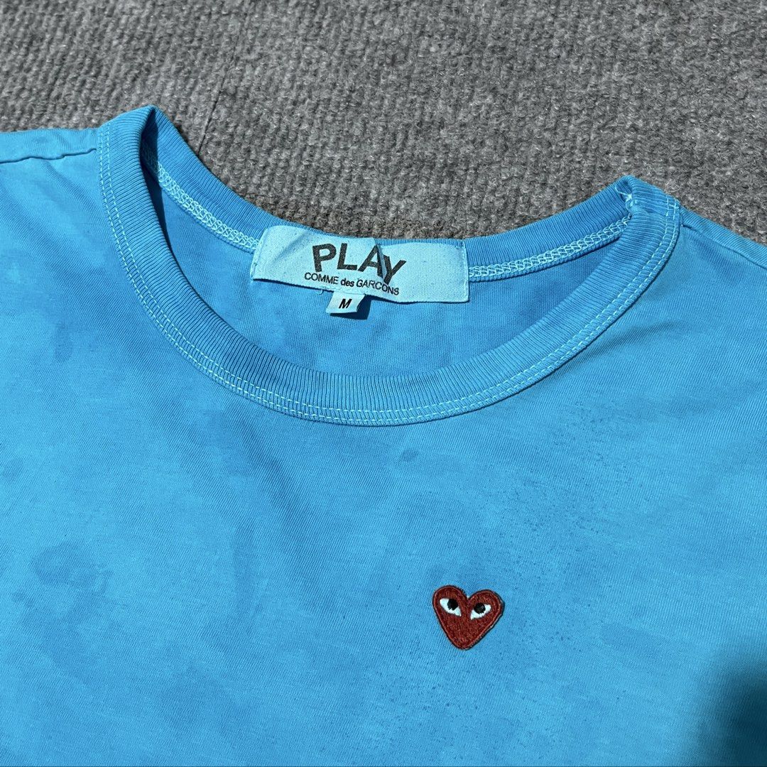 cdg play top shirt (Category: Shirts) located in Malay. Submitted by oplt_dept. (Listing ID 1462359686, Image 3). Description: -washed & clean (ready to wear) -luxury essentials -size:small-medium -width:18 -length:24 -exellent condition .
