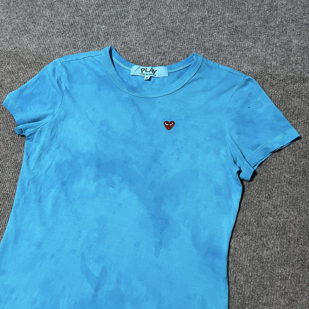 cdg play top shirt (Category: Shirts) located in Malay. Submitted by oplt_dept. (Listing ID 1462359686, Image 2). Description: -washed & clean (ready to wear) -luxury essentials -size:small-medium -width:18 -length:24 -exellent condition .