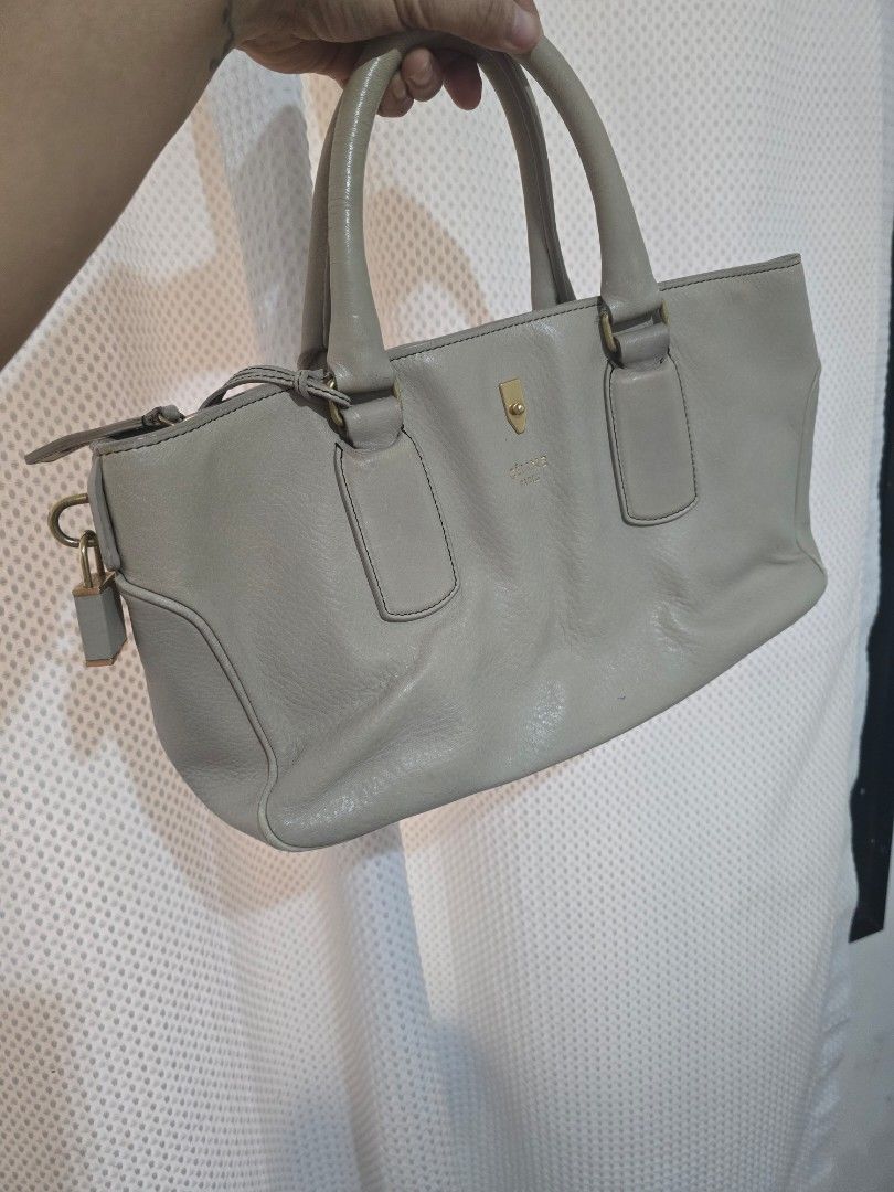 Celine Leather Handbag (Category: Luxury Bags & Wallets) located in Mandaluyong City. Submitted by mariasdesire (Listing ID 1462297086, Image 1). Description: - Beige Color Celine handbag - Made in Italy - Genuine leather material - Top handles - Zip closure - Interior zip pocket and slip pockets - Gold hardware details - Perfect for everyday use - Well used. Expect some flaws but the item is guaranteed authentic.