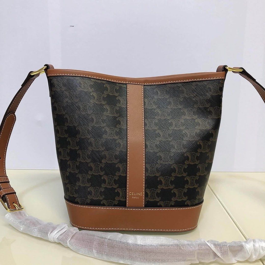 Celine Triomphe Canvas Bucket Bag (Category: Community) located in Angeles City. Submitted by migs_font29 (Listing ID 1462377800, Image 1). Description: - Authentic Celine Triomphe Bucket Bag - Signature Triomphe Canvas with Tan Leather Trim - Made in Italy - Adjustable Shoulder Strap - Interior Slip Pocket - Dust Bag Included - Ideal for Everyday Use.
