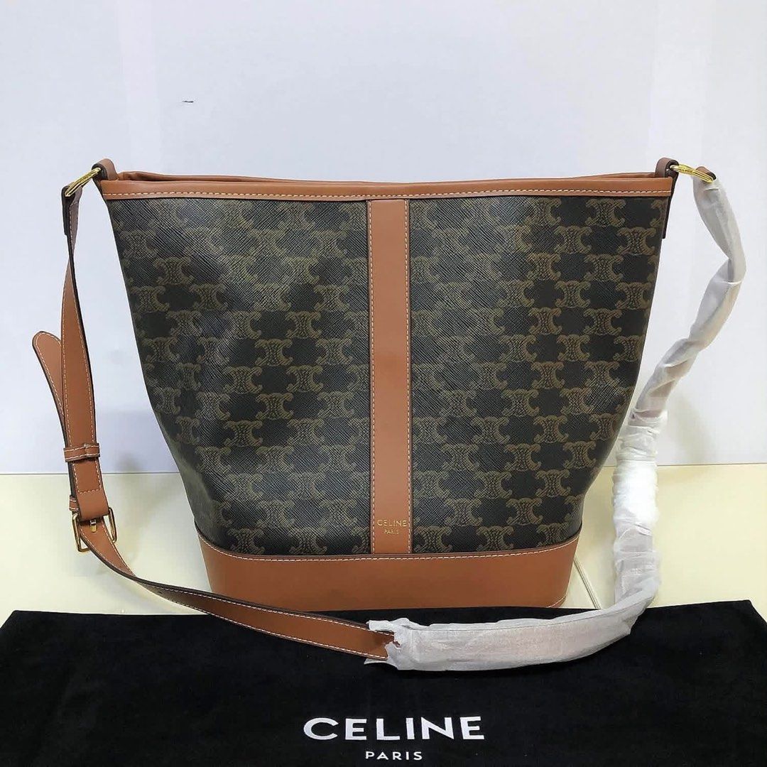 Celine Triomphe Canvas Bucket Bag (Category: Community) located in Angeles City. Submitted by migs_font29 (Listing ID 1462377800, Image 2). Description: - Authentic Celine Triomphe Bucket Bag - Signature Triomphe Canvas with Tan Leather Trim - Made in Italy - Adjustable Shoulder Strap - Interior Slip Pocket - Dust Bag Included - Ideal for Everyday Use.