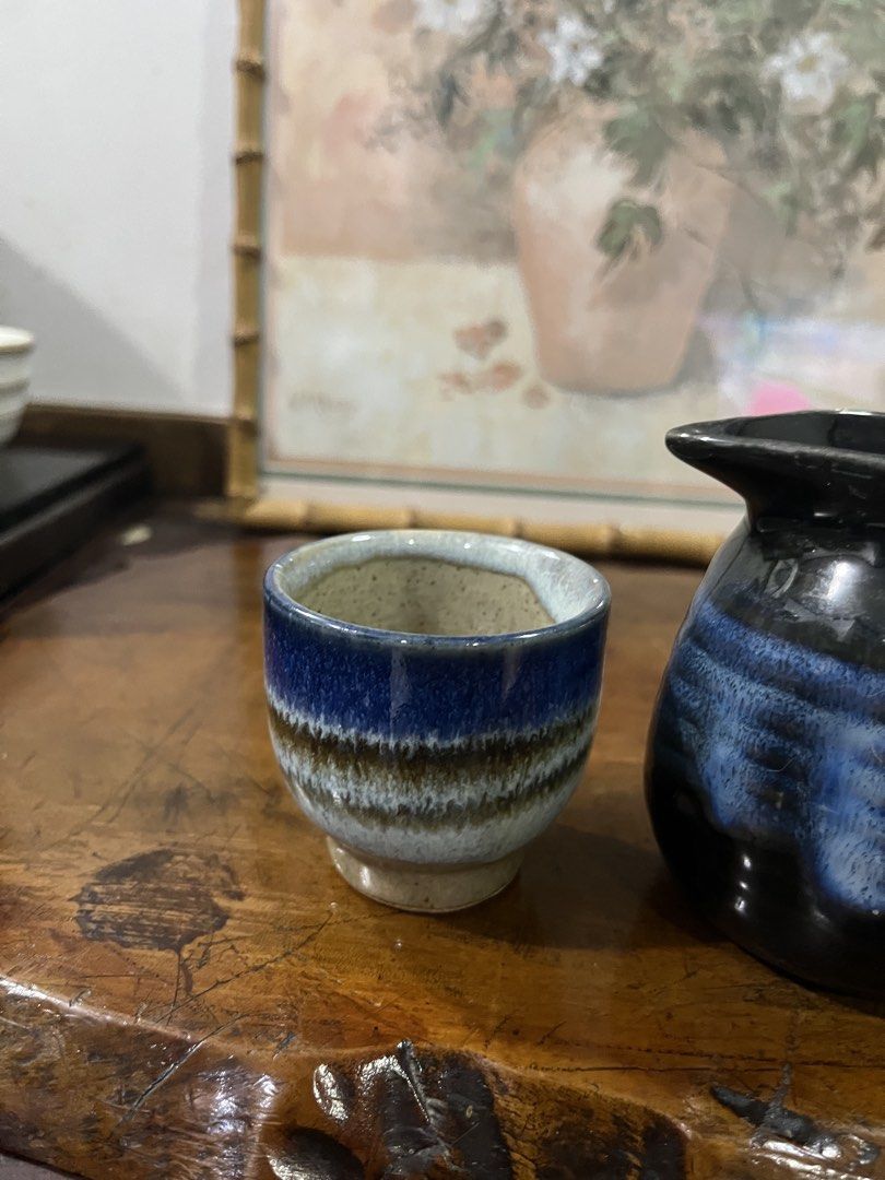 Ceramic Sake Set with Pitcher and Two Cups (Category: Coffee & Tea Tableware) located in Taguig. Submitted by minmin_parker (Listing ID 1462369410, Image 3). Description: - Cute ceramic sake set - Includes 1 small pitcher and 2 cups - Glazed in deep blue, black, and earthy tones - Unique handmade aesthetic - Perfect for sharing sake with a friend - Ideal for both display and practical use.