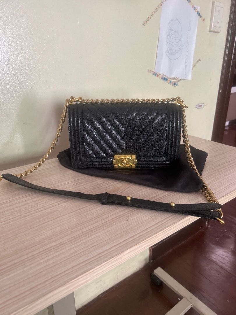 Chanel Boy Bag Black Chevron Leather Gold Hardware (Category: Luxury Bags & Wallets) located in Cebu City. Submitted by serene_simplicity (Listing ID 1462310752, Image 1). Description: - “OG quality” Classic Chanel Boy Bag - Black chevron leather - Gold hardware and chain strap - Comes with dust bag - Perfect for day or night use - A timeless addition to your collection - Selling as is.