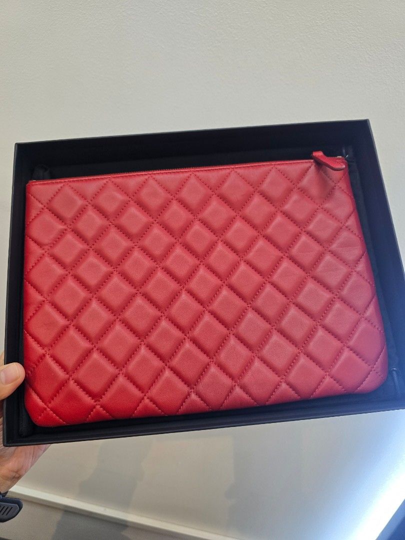 Chanel O-Case Red Quilted Medium Zip Pouch Bag (Category: Luxury Accessories) located in Taguig. Submitted by mluxeph (Listing ID 1462294087, Image 2). Description: Chanel O-Case Red Quilted Medium Zip Pouch Bag Gender: Unisex Material: Lambskin leather Stamp: 20350593 Year: 2014-2015 Interior: One main compartment Measurements: 11”L X 8”H Handle Drop: None Hardware: Gunmetal Inclusions: Original box, original dust bag and authenticity card from 