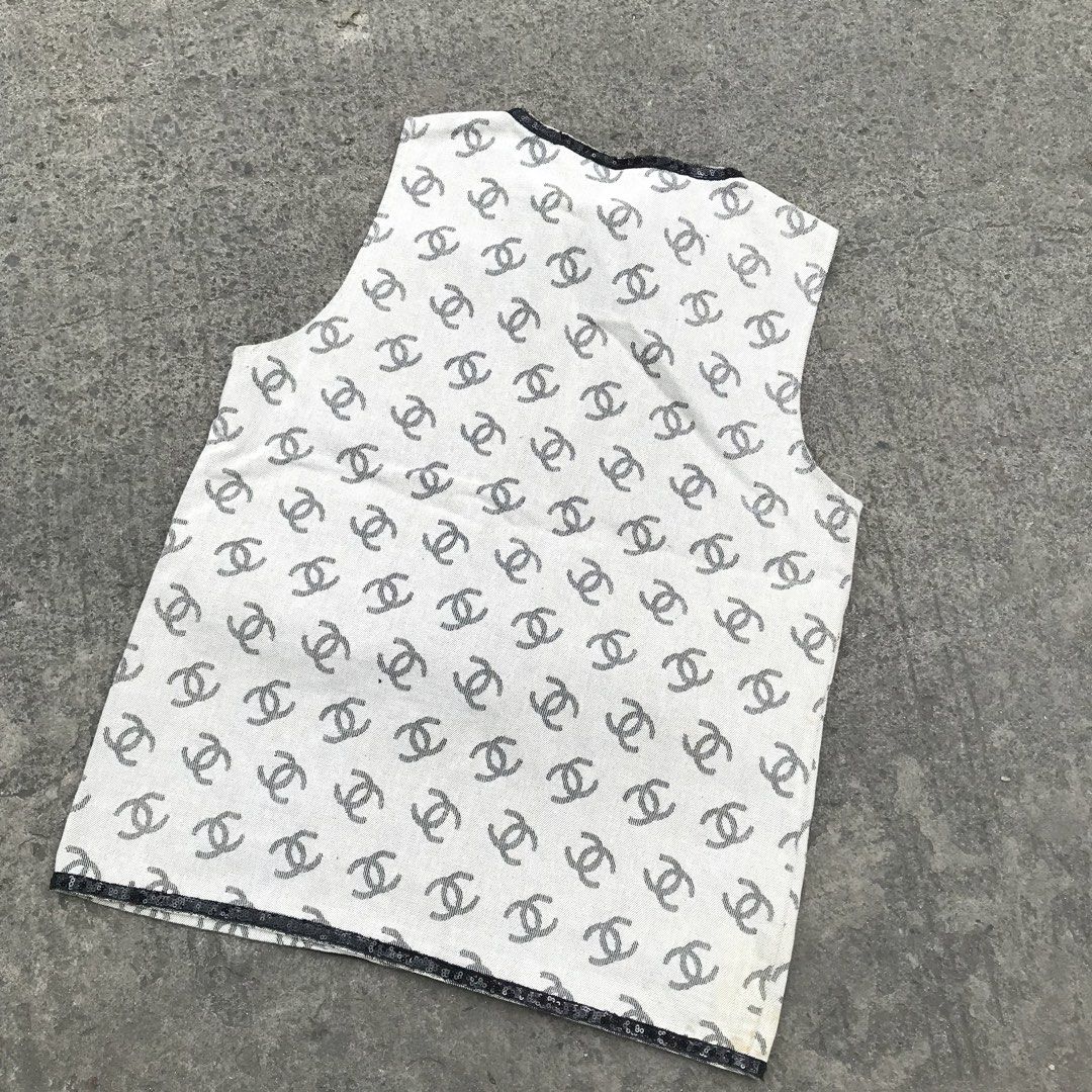 CHANEL-CC LOGO PATTERN SLEEVELESS DENIM VEST (Category: Luxury Apparel) located in Bulacan. Submitted by xxboutique2428 (Listing ID 1462288203, Image 3). Description: CHANEL-CC LOGO PATTERN SLEEVELESS DENIM VEST ✨ Stylish • Classic • Elegant • Versatile ✨ Elevate your everyday look with this stylish sleeveless vest/top featuring an elegant all-over interlocking CC-style pattern and contrasting black details. PRODUCT DETAILS: 🤍 Color: White / Off